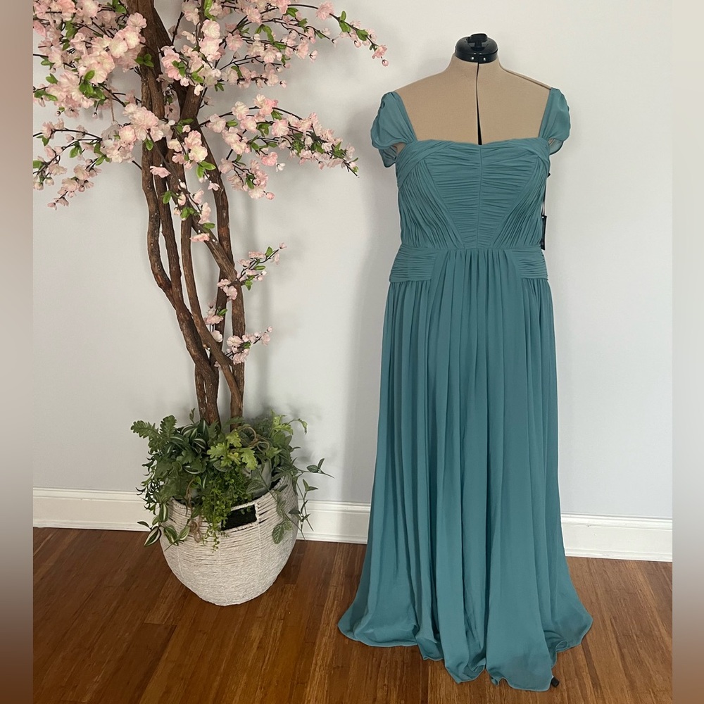 Turquoise Vera Wang off shoulder gown.